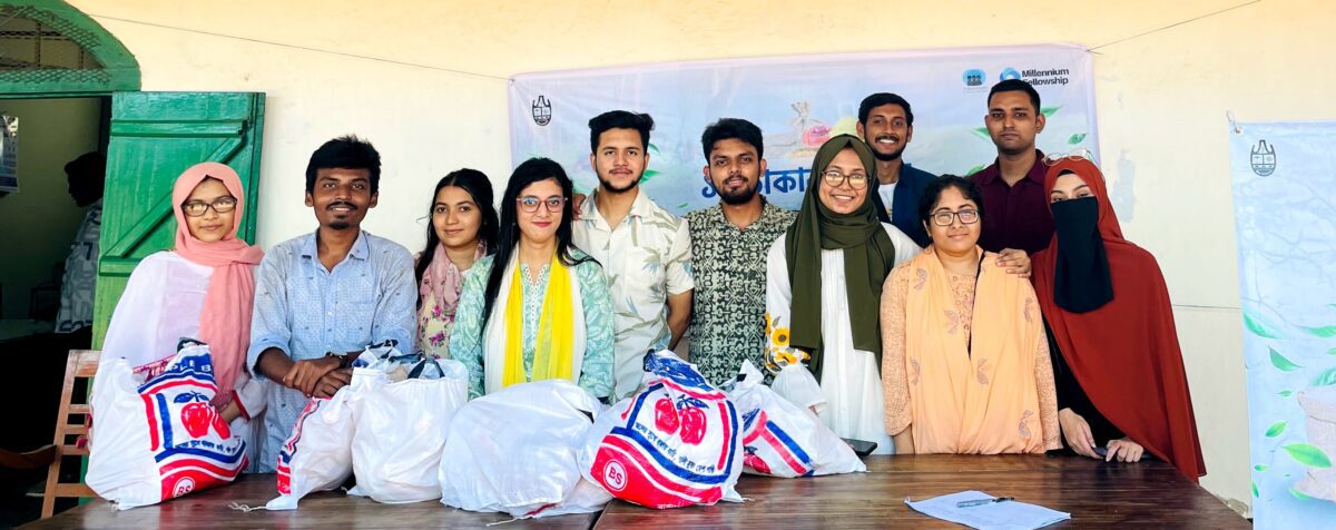 University of Chittagong students pose in front of project poster